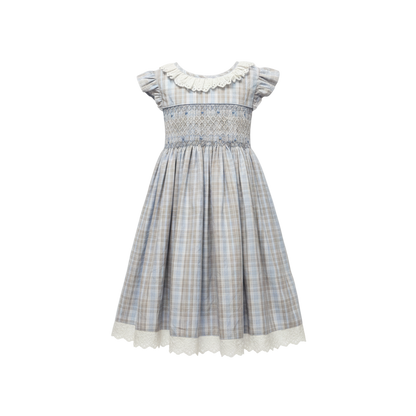 Plaid dress with white collar on a light gray background