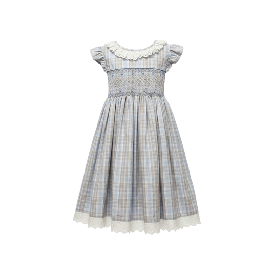 Plaid dress with white collar on a light gray background