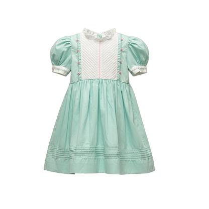 Mint green dress with white collar and pink accents on a white background