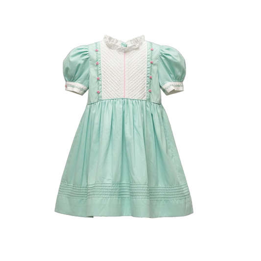 Mint green dress with white collar and pink accents on a white background